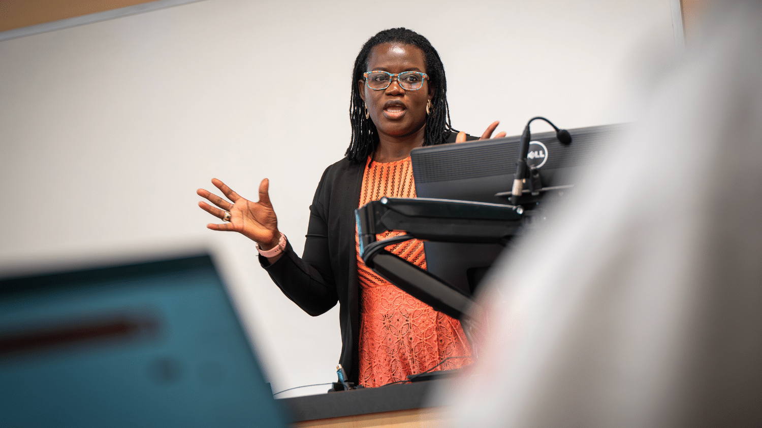 An instructor speaks to a class