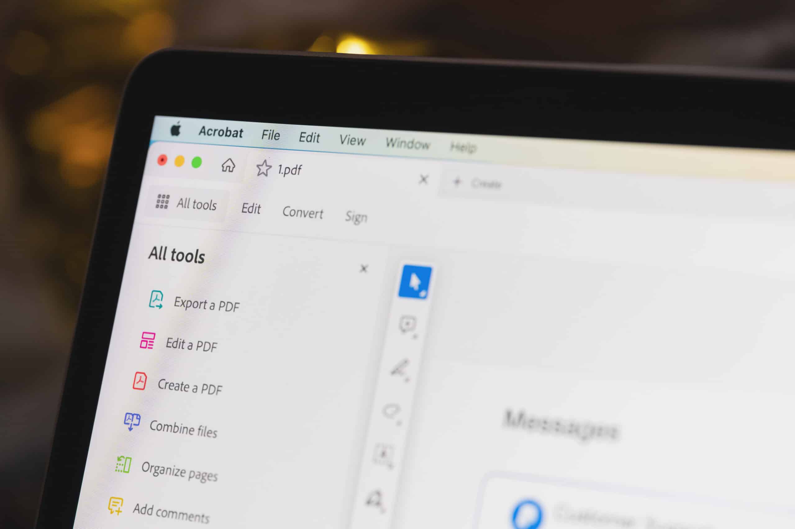 Laptop showing tools in Adobe Acrobat